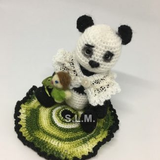PANDA with its doll  ( adopted - USA )